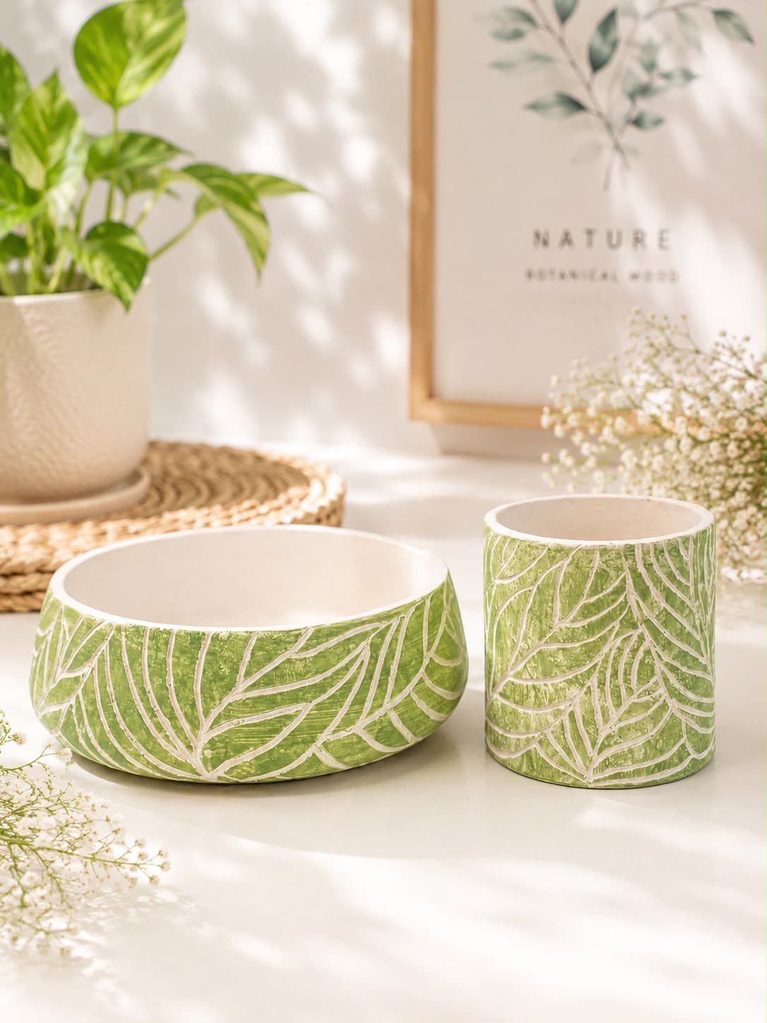Bowl and pot carved with leaf and frond patterns in sage green over white